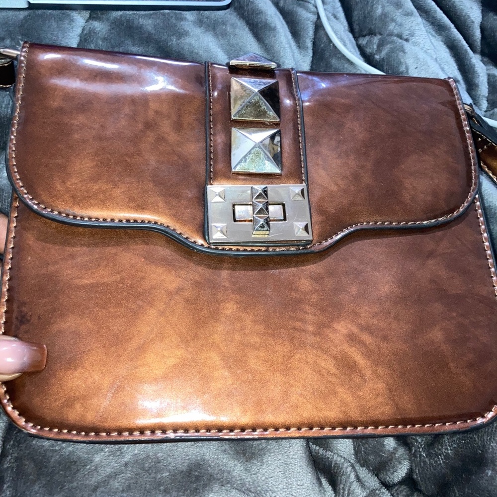 Brown and gold embossed crossbody bag